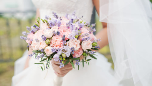Wedding bouquet of lavender, roses and peonies.
